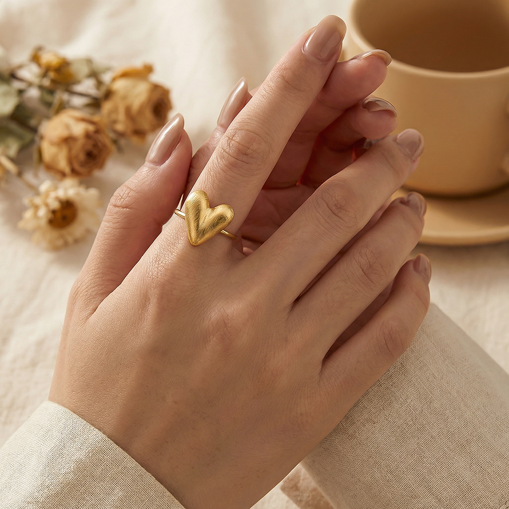Stainless steel ring with adjustable matt heart