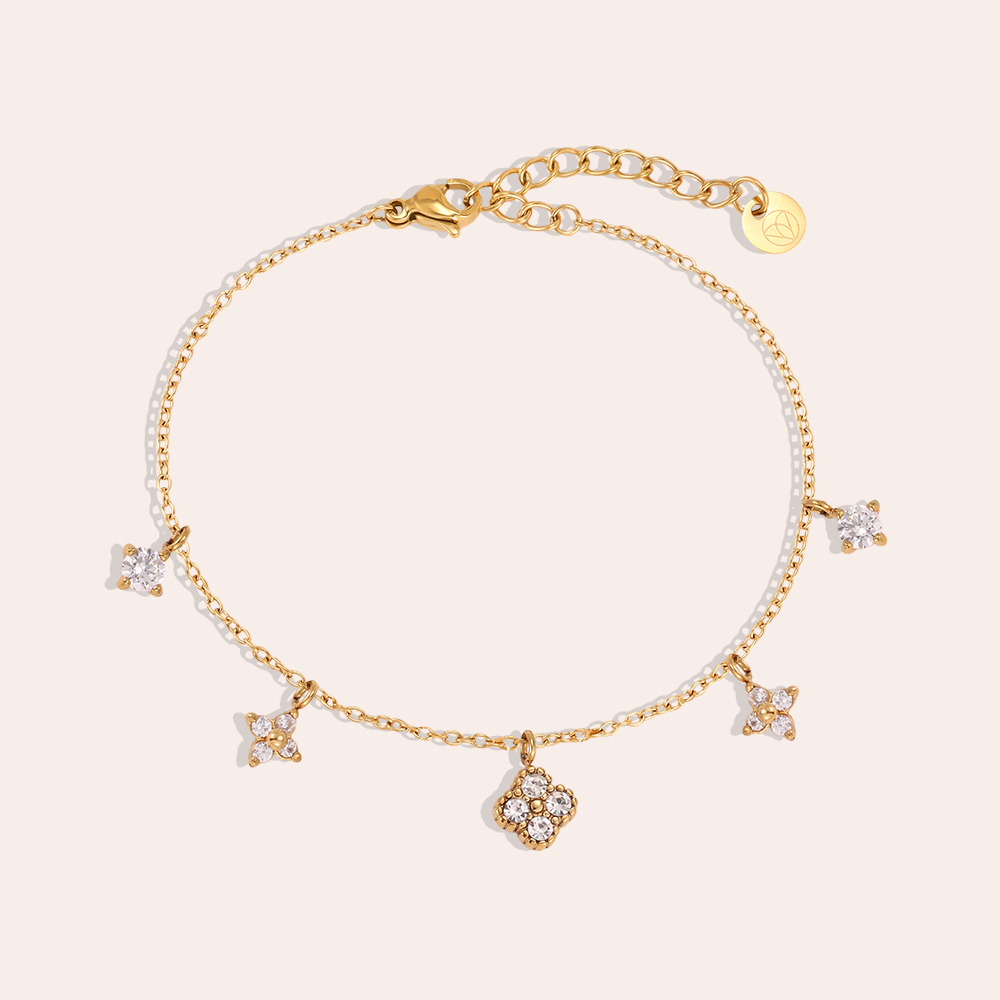 Stainless steel bracelet, 17 cm, with various cubic zirconia cloverleaf designs 