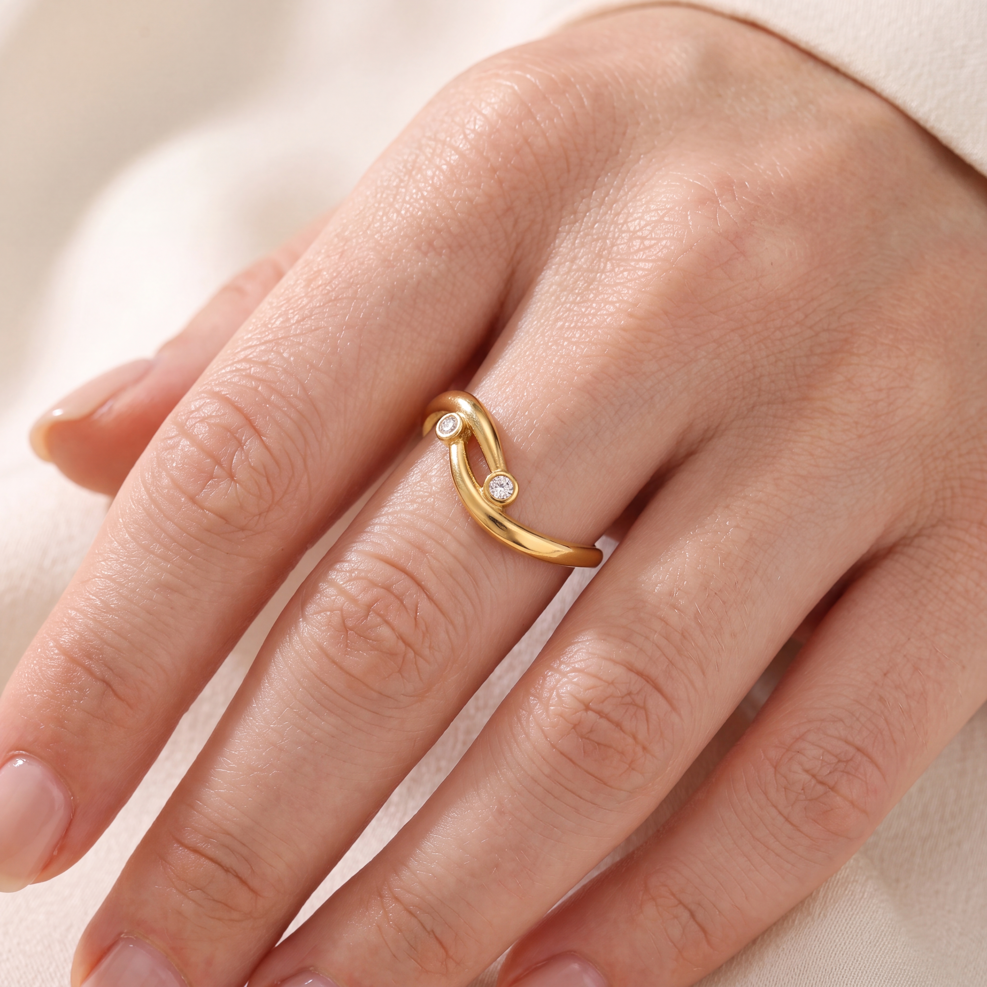 Stainless steel ring with adjustable, curved lines and cubic zirconia