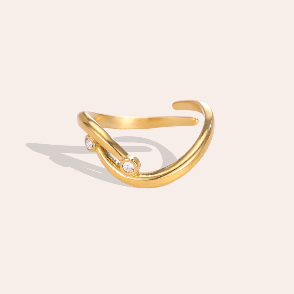 Stainless steel ring with adjustable, curved lines and cubic zirconia