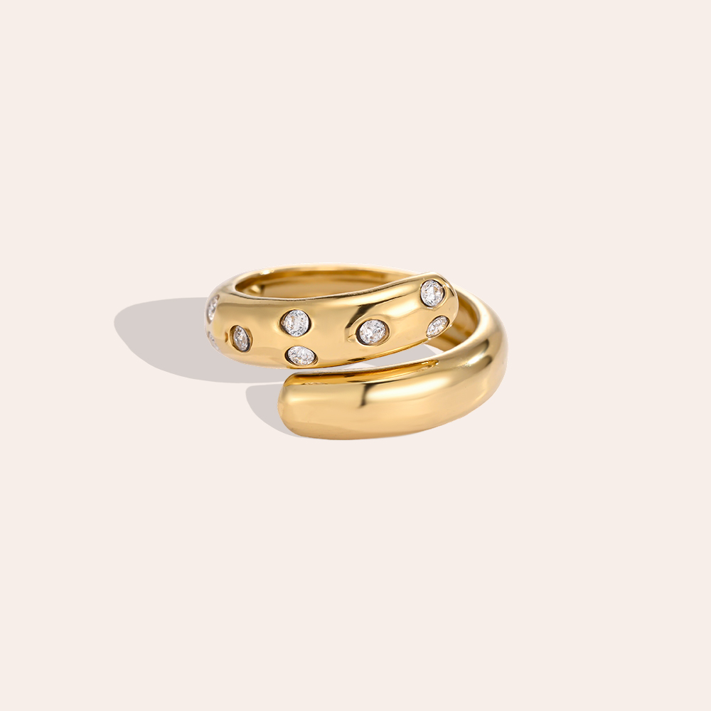 Adjustable stainless steel wrap-around ring with small cubic zirconia stones