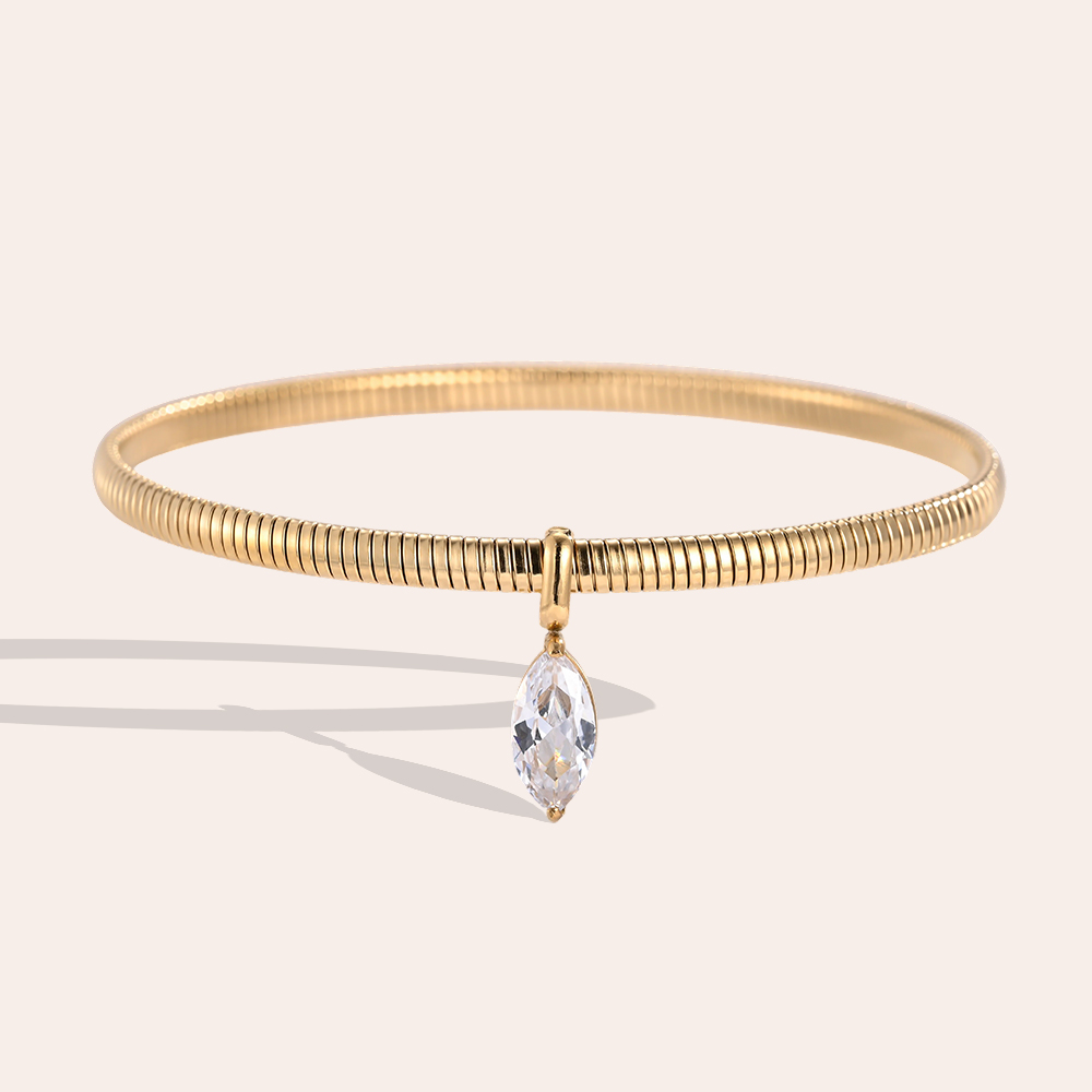 Stainless steel bangle, 6.2 cm, gold-coloured with eye-shaped cubic zirconia