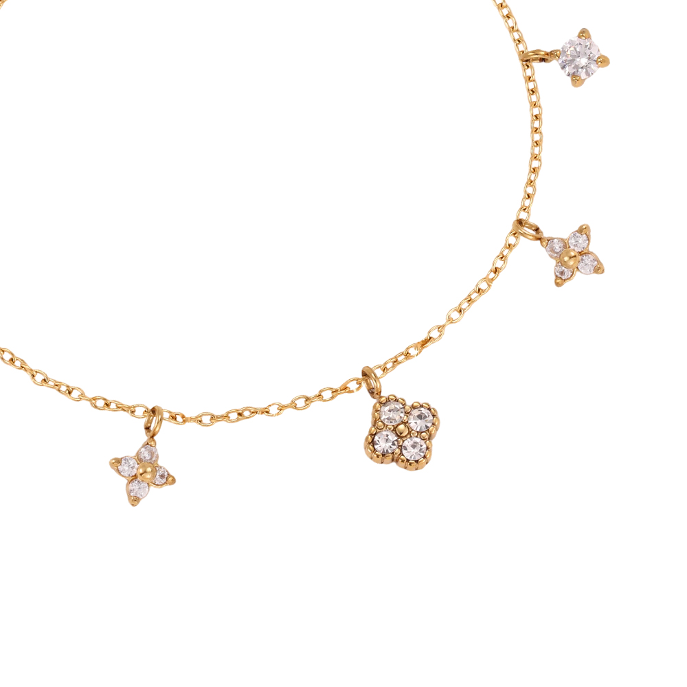 Stainless steel bracelet, 17 cm, with various cubic zirconia cloverleaf designs 