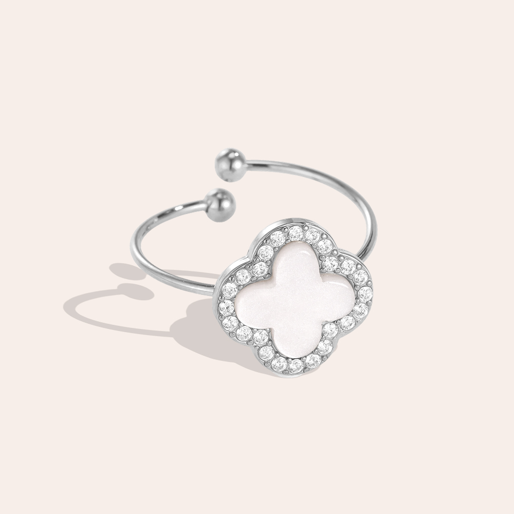 Stainless steel ring with an adjustable acrylic shamrock and a zirconia border