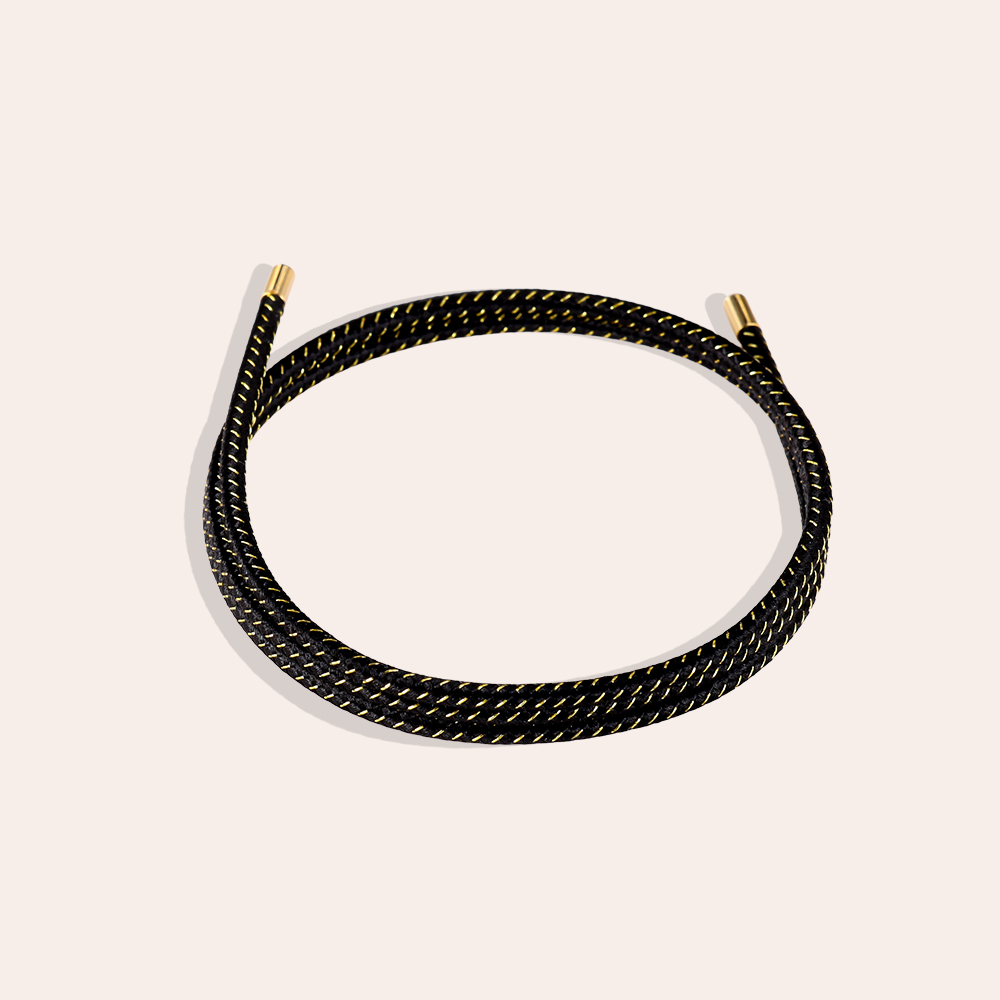 Stainless steel bracelet, black with gold lines, made of elastic polyester 