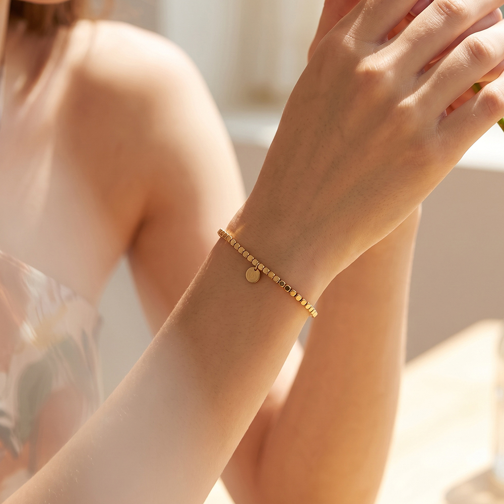 Stainless steel bracelet, elasticated, with small squares