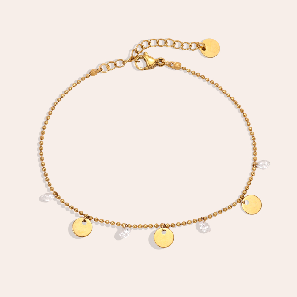 Stainless steel bracelet, 16 cm, with gold-coloured discs and cubic zirconia  