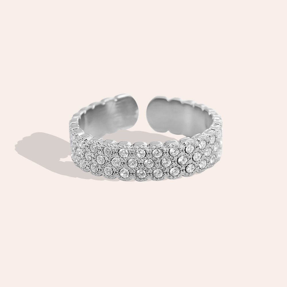 Stainless steel ring, adjustable, set with many small, sparkling cubic zirconia stones
