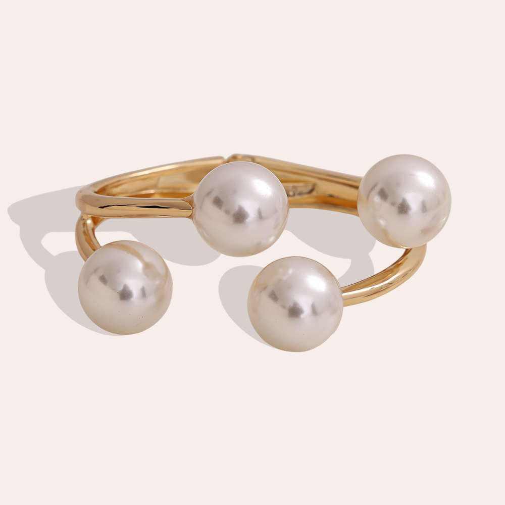 6.5cm wide round bangle with four brass beads