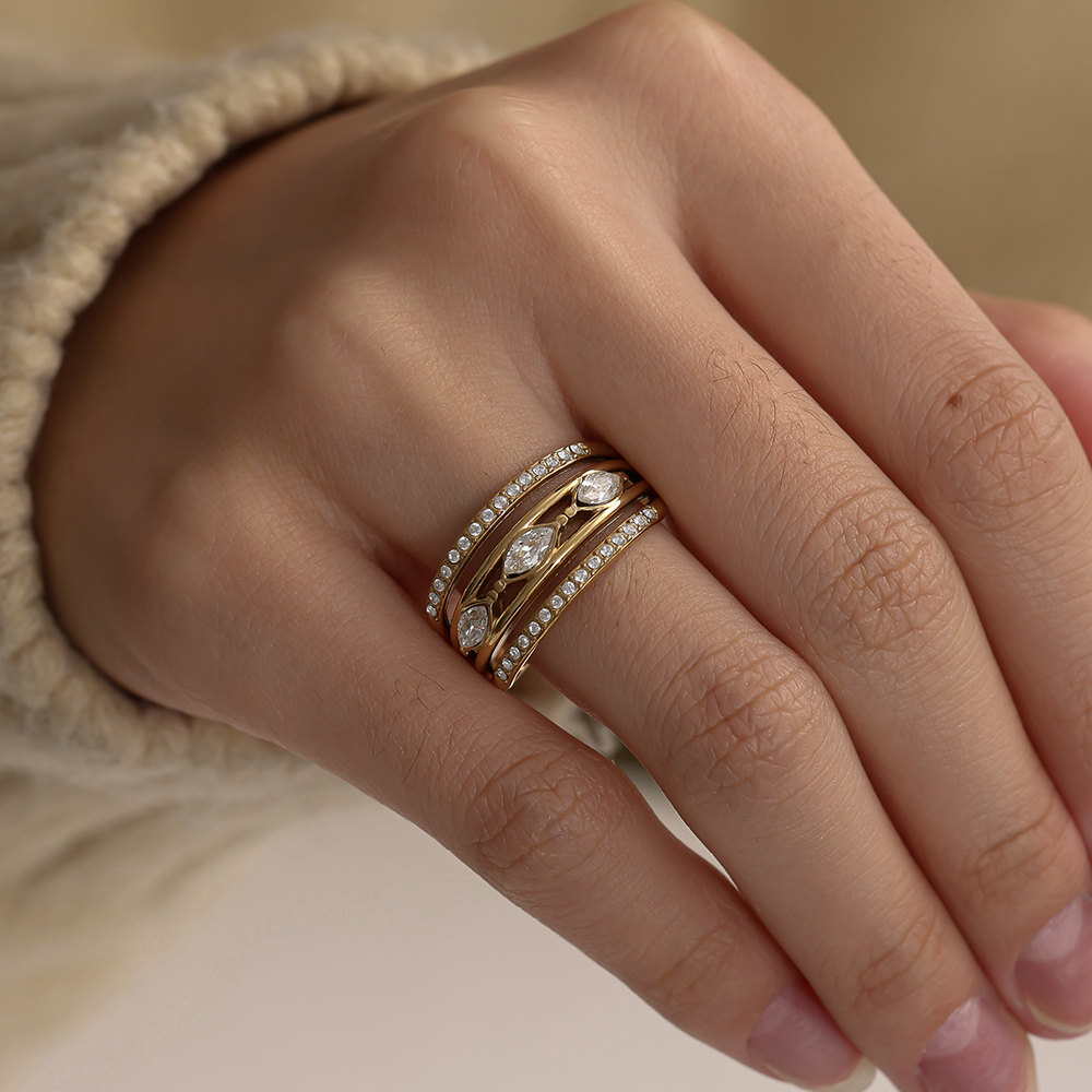 Stainless steel ring, adjustable, three-layered, with some cubic zirconia 