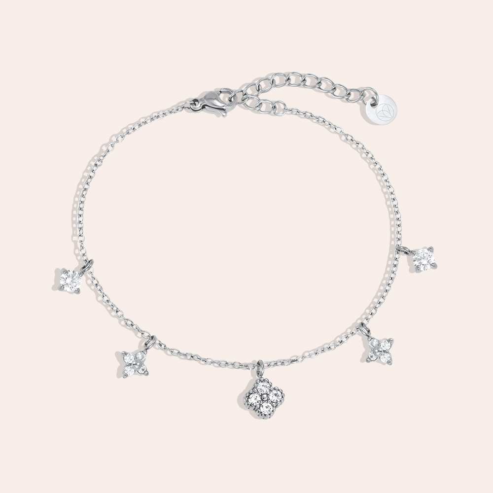 Stainless steel bracelet, 17 cm, with various cubic zirconia cloverleaf designs 