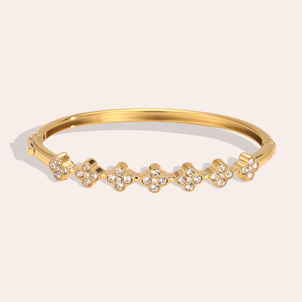 Stainless steel bangle, 6 cm, with lots of cubic zirconia in a cloverleaf design   
