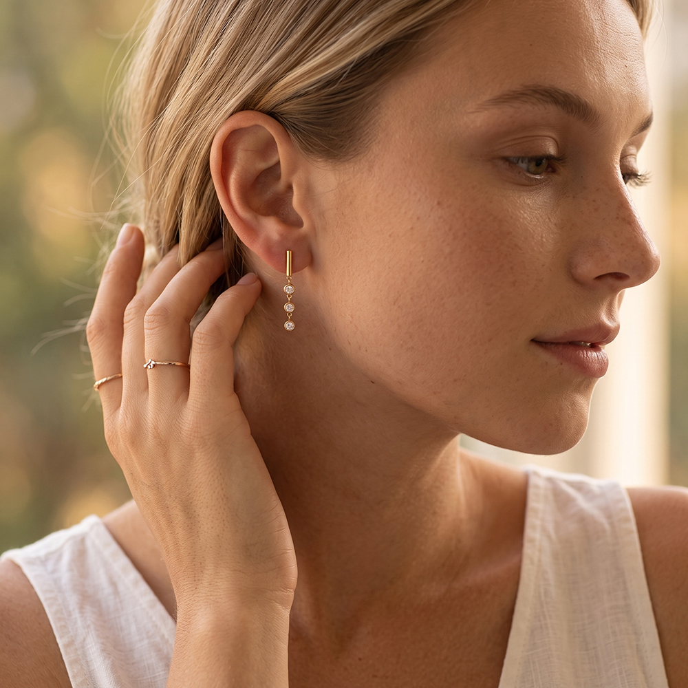 Stainless steel earrings, 32×4 mm, three round cubic zirconia stones